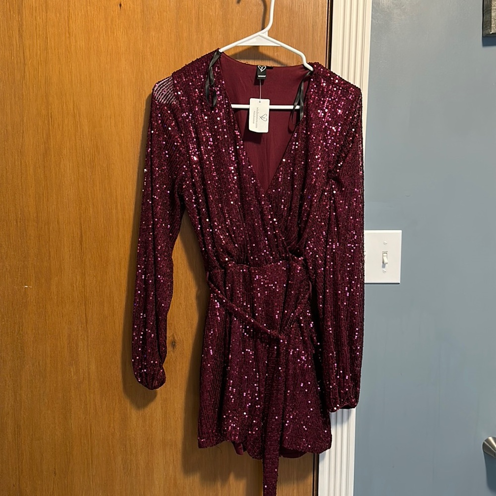 Brand new , didn’t fit me . Dark burgundy SIZE M ! It’s beautiful!